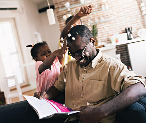 father playing with children