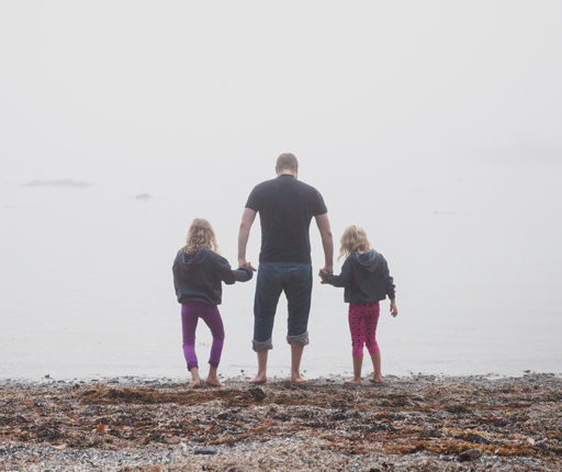 Dad with daughters at beach